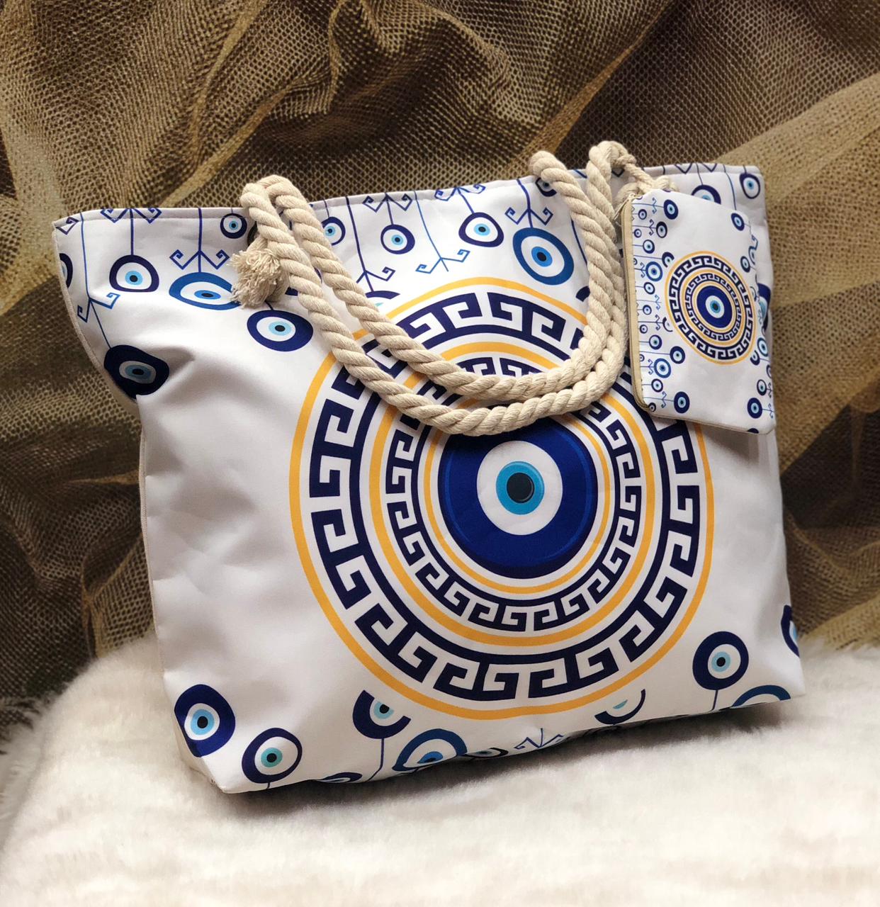 Decorative bag with blue and yellow patterns on a textured surface